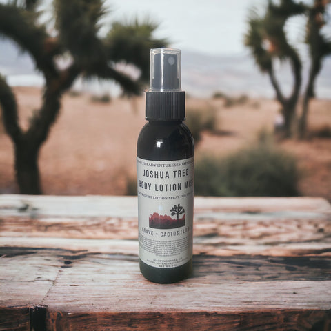 Joshua Tree Body Lotion Mist sitting on table with joshua trees in background