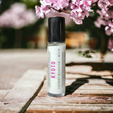 Kyoto Perfume Oil with cherry blossoms in background