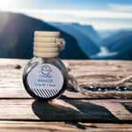 Fjord Breeze Car Diffuser on wooden table with fjords in background