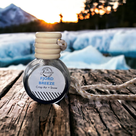 Fjord Breeze Car Diffuser on wooden table with icy mountain in background