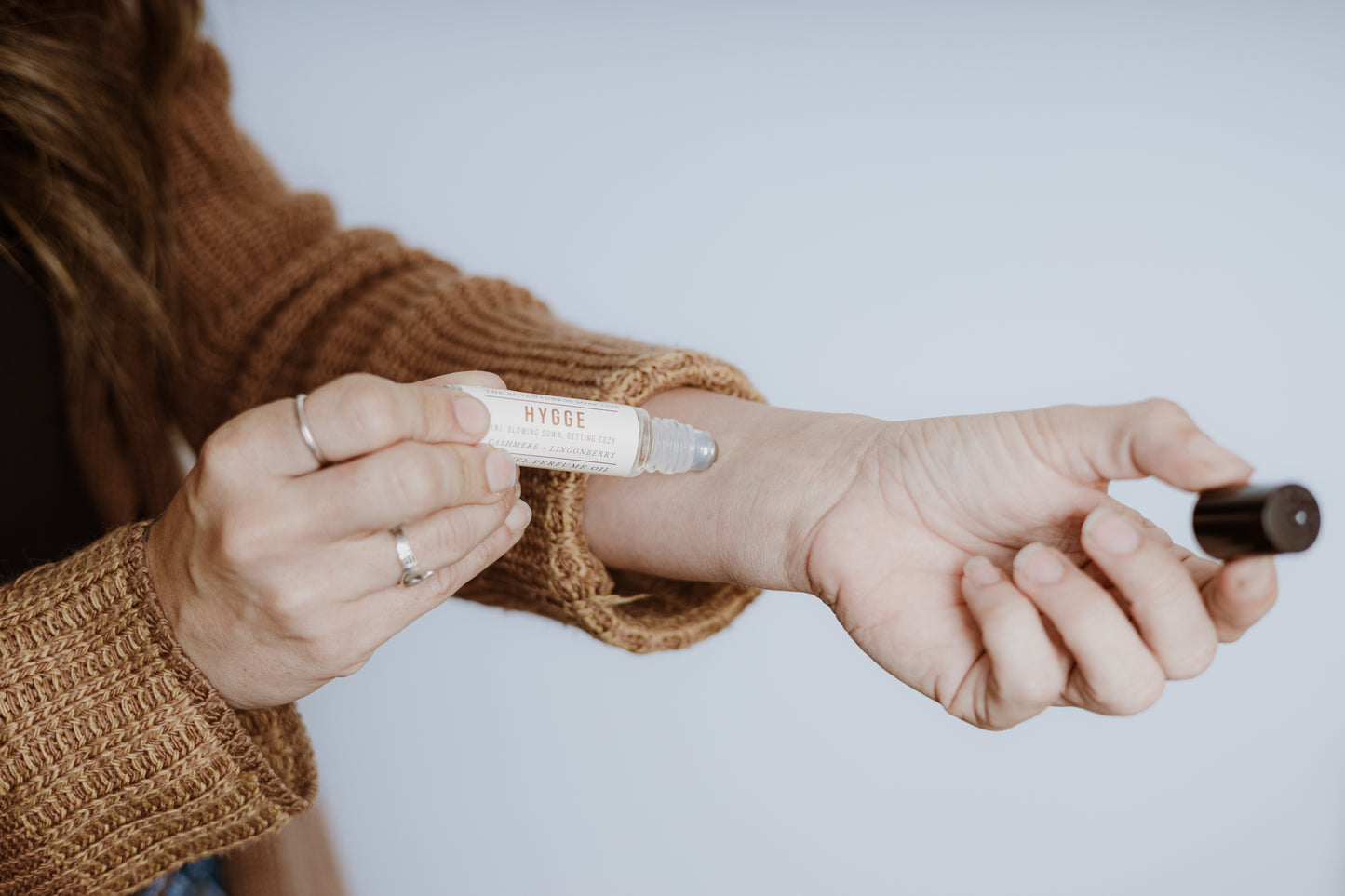 Hygge Perfume Oil being applied by woman