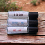 Sedona Perfume Oil, Joshua Tree Perfume Oil, Mojave Perfume Oil on top of wooden table