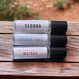 Sedona Perfume Oil, Joshua Tree Perfume Oil, Mojave Perfume Oil on top of wooden table