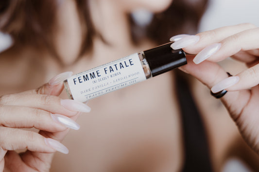 Femme Fatale Perfume Oil being held by woman