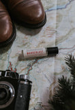 Wanderlust Perfume Oil on a background with a map. 