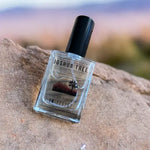 Joshua Tree Eau de Parfum laying on rock in desert
