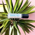 Joshua Tree Travel Perfume Oil laying in middle of green agave plant