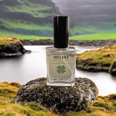 Ireland Eau de Parfum laying on rock with Ireland in background