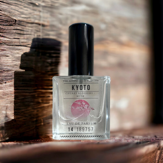 Kyoto Eau de Parfum sitting on wooden table with dark wood background