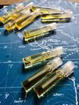 perfume oil samples displayed on a blue map background
