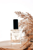 femme fatale perfume with boho background