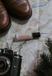 wanderlust travel perfume oil on map background